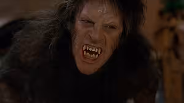 A werewolf with matted fur baring its teeth