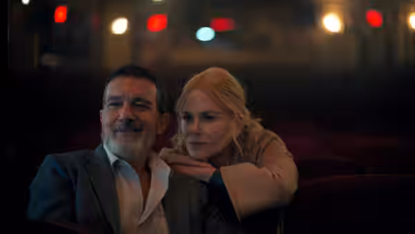 Romy (Nicole Kidman) resting her hand on Jacob (Antonio Banderas) in a theater
