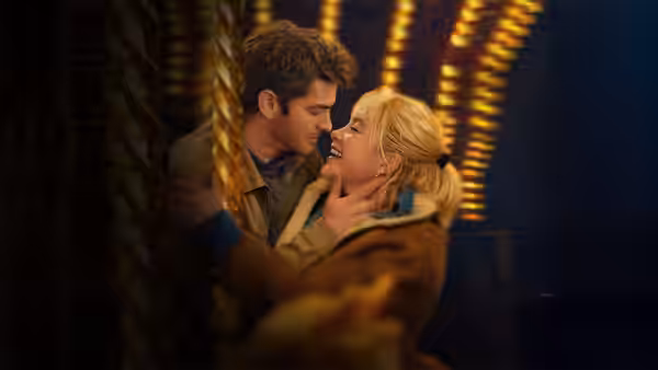 Tobias (Andrew Garfield) and Almut (Florence Pugh) embrace closely with foreheads touching
