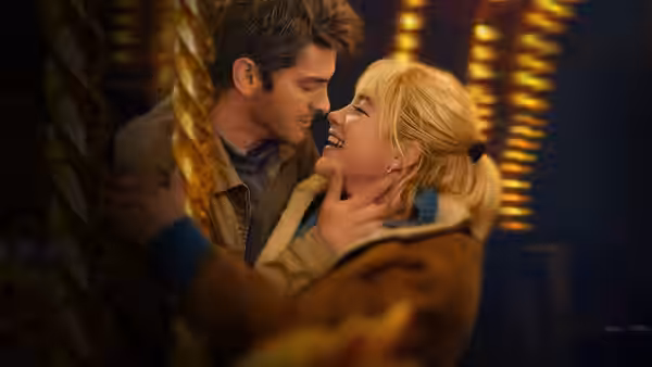 Tobias (Andrew Garfield) and Almut (Florence Pugh) touch foreheads during an intimate embrace