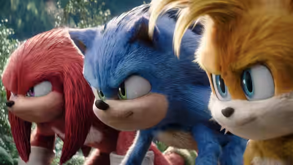 Knuckles, Sonic and Tails running side by side through a forest